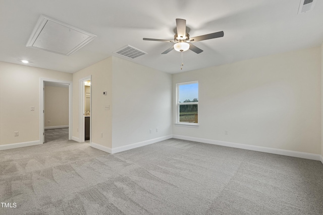 unfurnished room with ceiling fan and light carpet