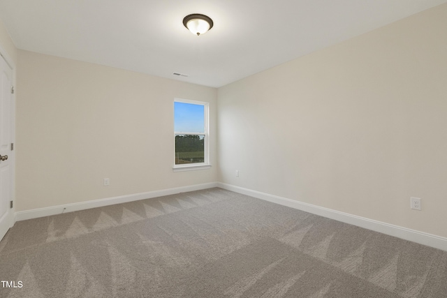 spare room featuring carpet floors