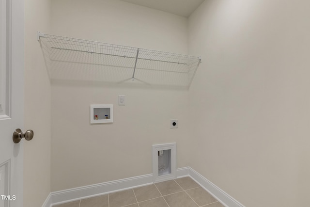 washroom with washer hookup, light tile patterned floors, and hookup for an electric dryer