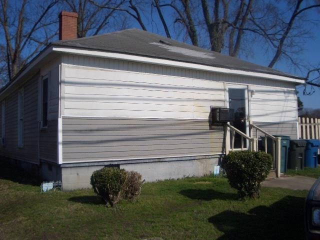 view of home's exterior featuring a yard