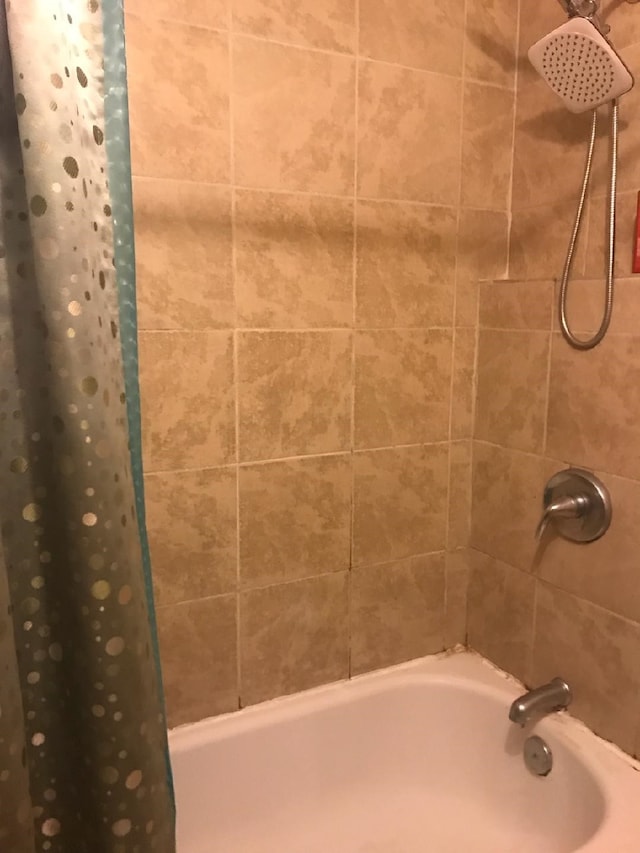 bathroom featuring shower / bath combination with curtain