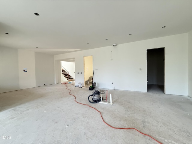 spare room featuring stairway