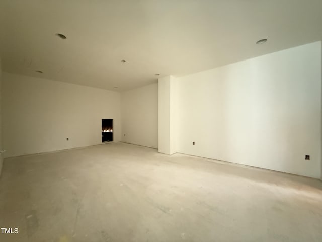 spare room with concrete flooring