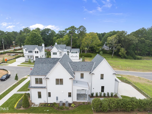 back of property featuring a garage