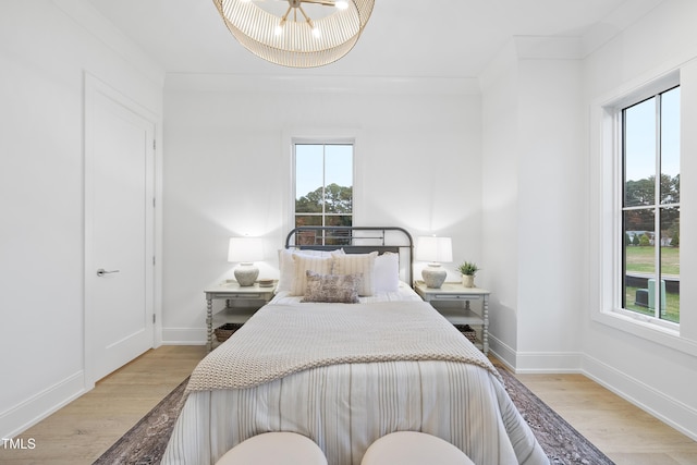 bedroom with light hardwood / wood-style floors