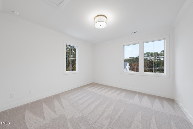 3401 Makers Cir, Raleigh, NC 27612 - empty room featuring healthy amount of natural light, light carpet, and ornamental molding