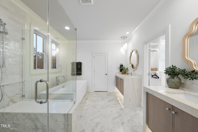 bathroom featuring vanity and shower with separate bathtub