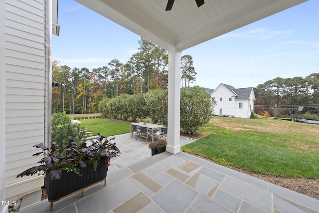 view of patio featuring ceiling fan