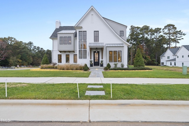 view of front of property with a front lawn