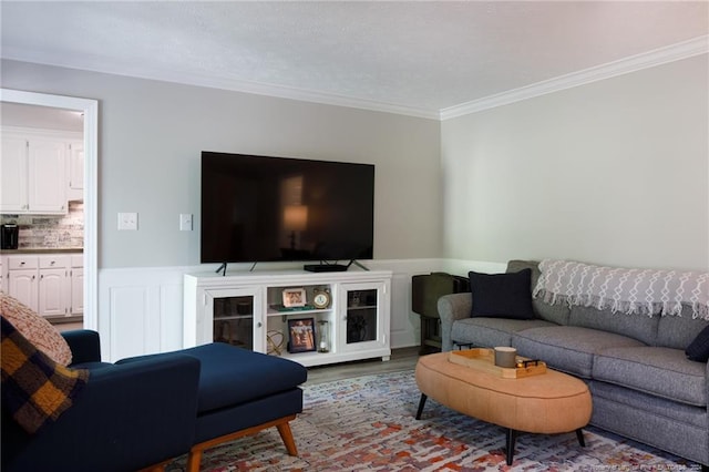 living room with crown molding and a textured ceiling