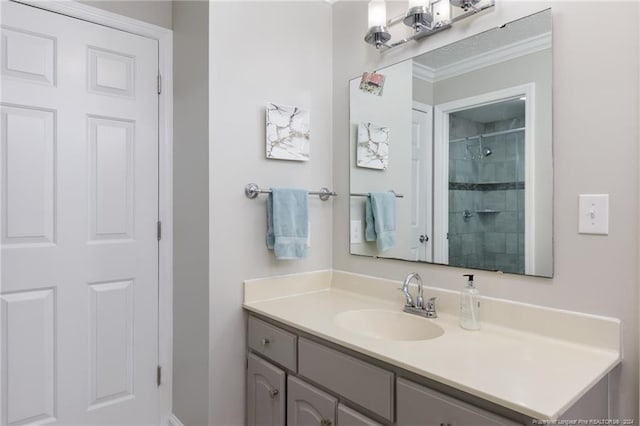 bathroom featuring vanity with extensive cabinet space and ornamental molding