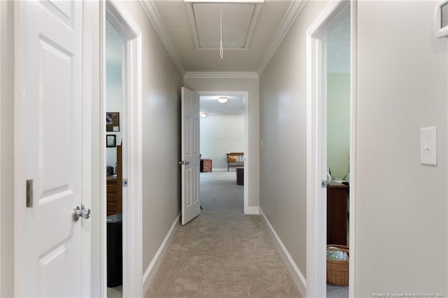 hallway with light colored carpet and crown molding