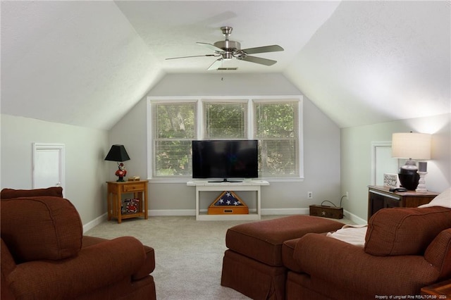 living room featuring light colored carpet, ceiling fan, and lofted ceiling