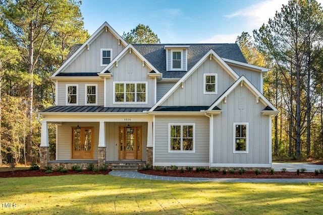 craftsman house featuring a front yard and covered porch