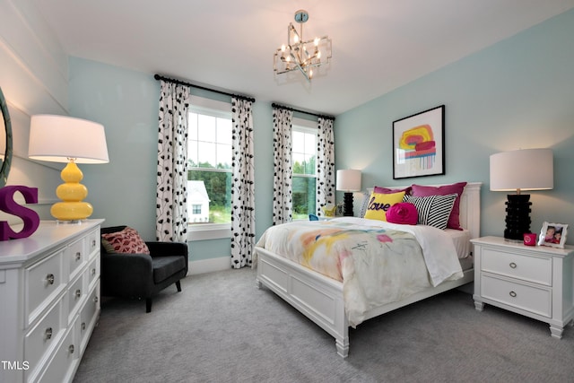 carpeted bedroom featuring a notable chandelier