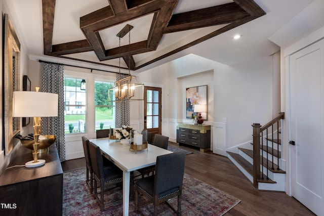 dining space featuring dark hardwood / wood-style flooring, coffered ceiling, and a chandelier