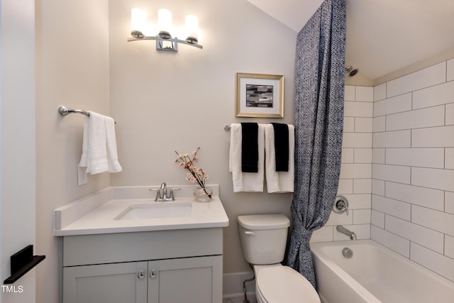 full bathroom featuring toilet, vanity, and tiled shower / bath