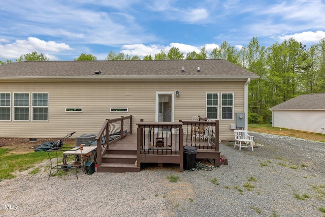 rear view of house featuring a deck