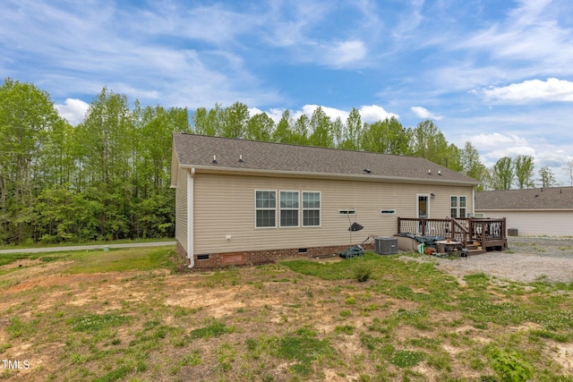 back of house with central AC and a wooden deck