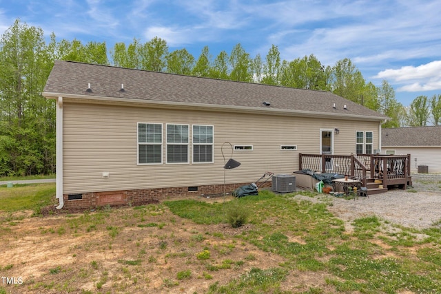 rear view of property featuring a deck and central AC unit