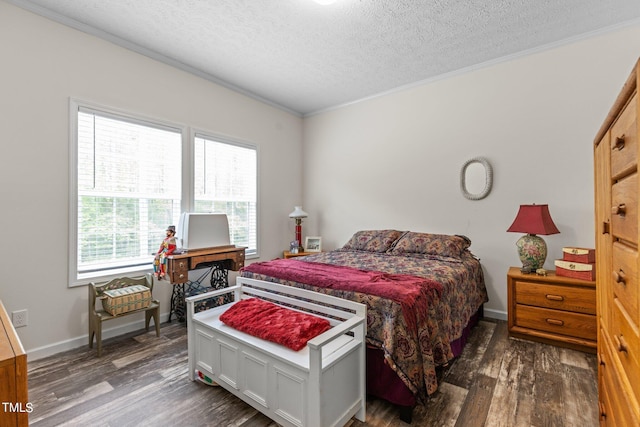 bedroom with a textured ceiling, dark wood-type flooring, and crown molding