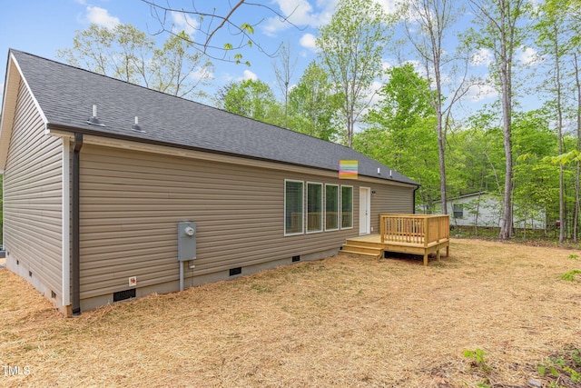 back of property featuring a wooden deck