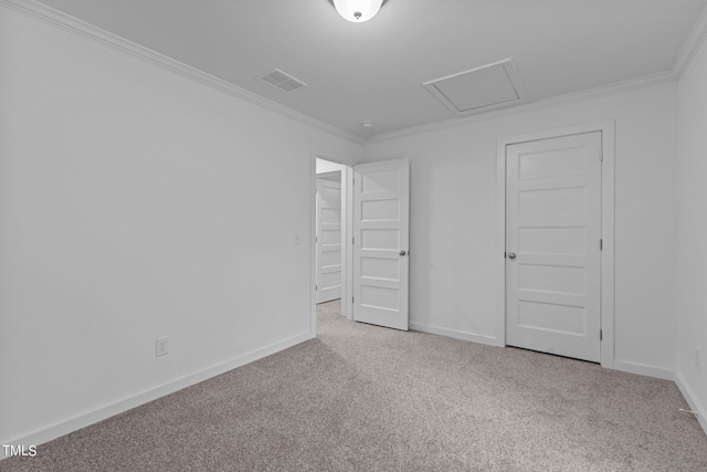 spare room featuring ornamental molding and light colored carpet