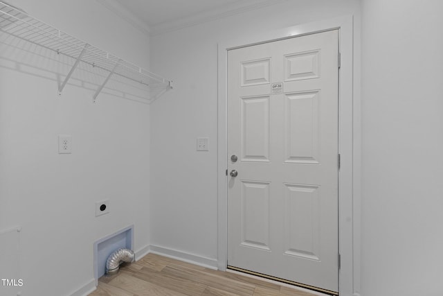 clothes washing area with crown molding, light hardwood / wood-style flooring, and electric dryer hookup