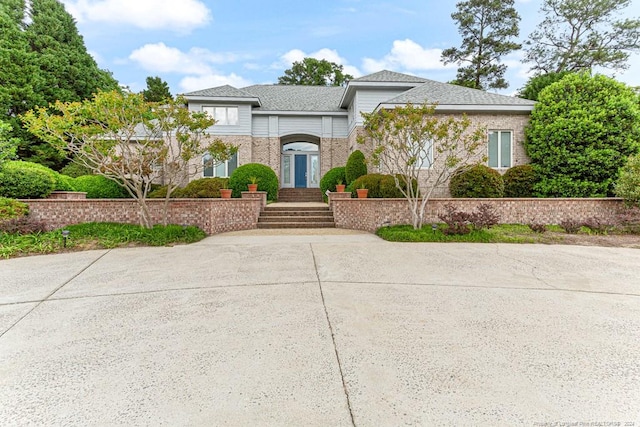 view of front of house featuring brick siding