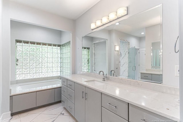 bathroom featuring vanity, independent shower and bath, and tile patterned floors