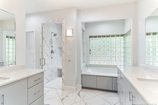 bathroom with vanity, independent shower and bath, and tile patterned floors