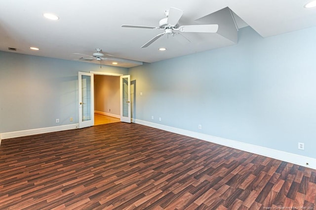 unfurnished room with ceiling fan and dark wood-type flooring