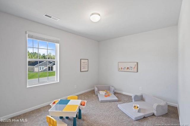 recreation room with baseboards, visible vents, and carpet floors