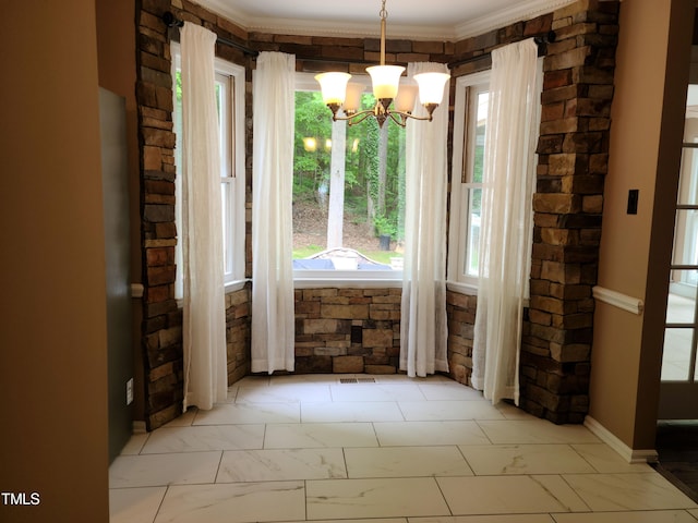 unfurnished dining area with ornamental molding, an inviting chandelier, and tile floors