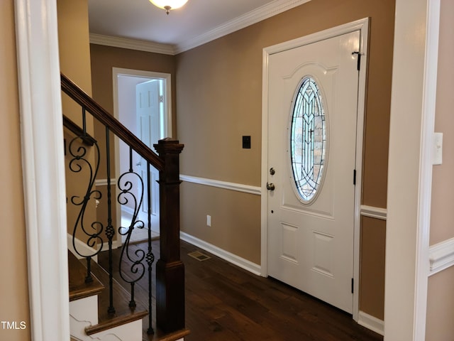 entrance foyer featuring dark hardwood / wood-style flooring and crown molding