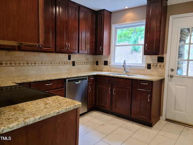 kitchen with light stone counters, sink, light tile floors, tasteful backsplash, and dishwasher