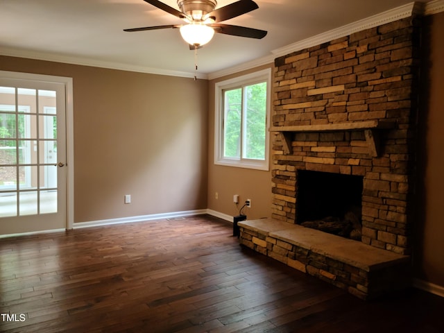 unfurnished living room featuring crown molding, dark hardwood / wood-style flooring, ceiling fan, and a fireplace