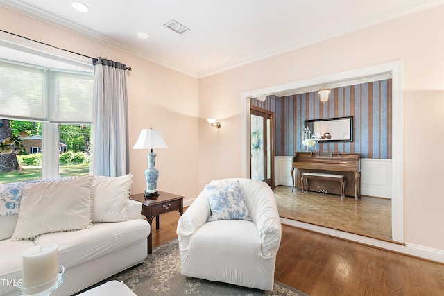 living room featuring crown molding and hardwood / wood-style flooring