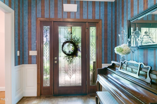 entrance foyer featuring plenty of natural light and parquet flooring