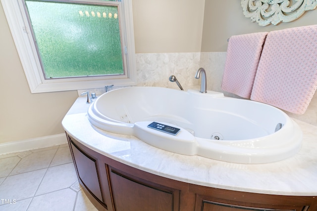 bathroom with tile floors and a bathtub