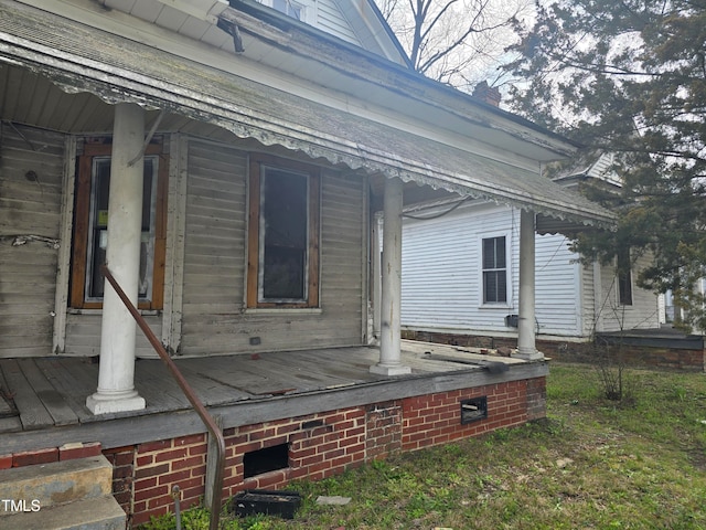 view of property exterior with a porch