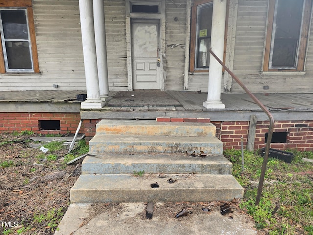 staircase featuring decorative columns