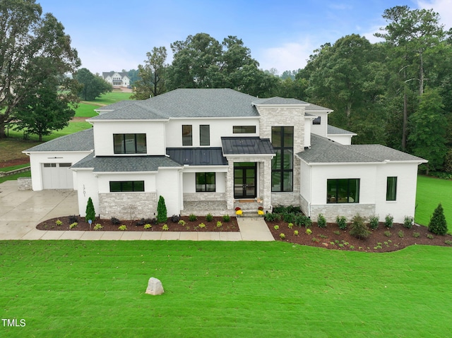 modern inspired farmhouse featuring a garage and a front lawn