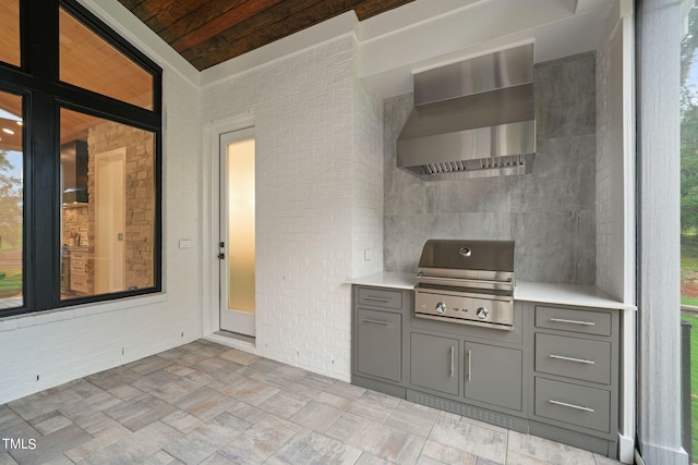 view of patio / terrace with grilling area and an outdoor kitchen