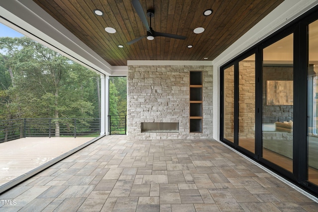 view of patio with a balcony and ceiling fan