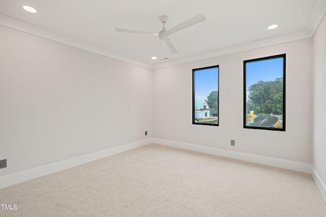 spare room featuring ceiling fan, recessed lighting, carpet flooring, baseboards, and crown molding