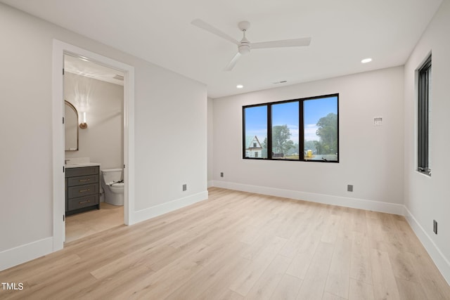 unfurnished bedroom featuring light wood-style floors and baseboards