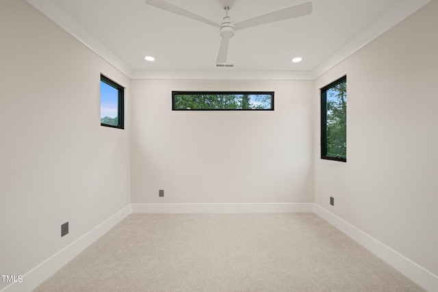 carpeted empty room featuring recessed lighting, visible vents, crown molding, and baseboards