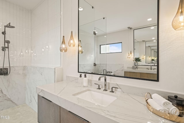 full bathroom featuring a shower stall and vanity