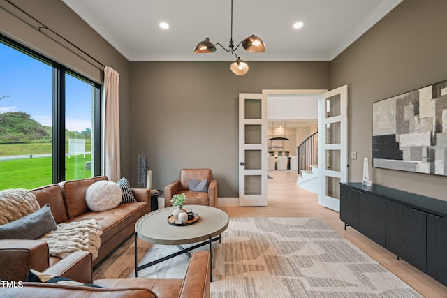 living room with french doors, recessed lighting, light wood-style flooring, and crown molding